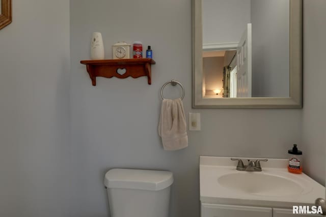 bathroom with toilet and vanity