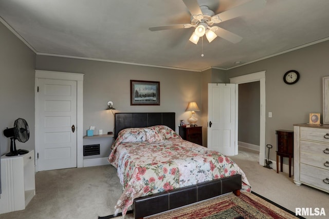 bedroom featuring ceiling fan, light colored carpet, and ornamental molding