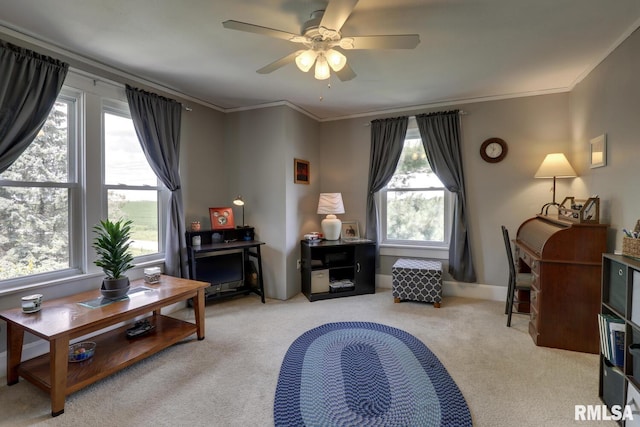 sitting room with ceiling fan, light colored carpet, and ornamental molding