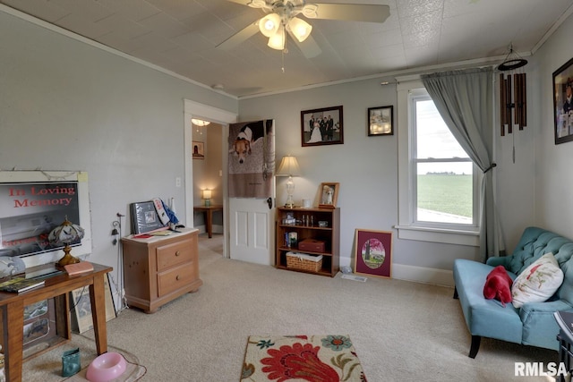 interior space featuring ceiling fan and ornamental molding