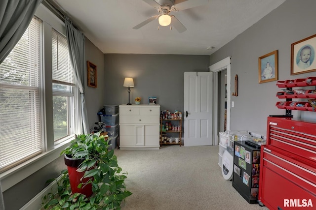 miscellaneous room with ceiling fan and light colored carpet