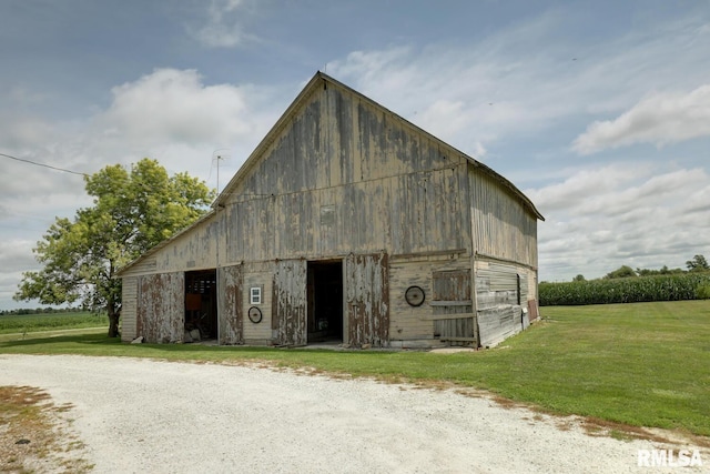 view of outdoor structure with a lawn