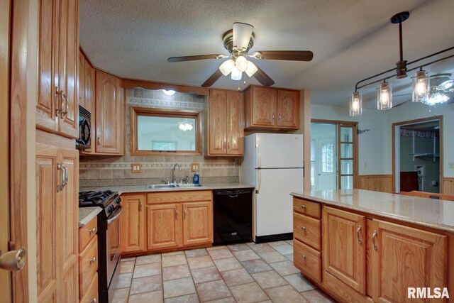 kitchen featuring tasteful backsplash, black appliances, light tile patterned flooring, hanging light fixtures, and ceiling fan