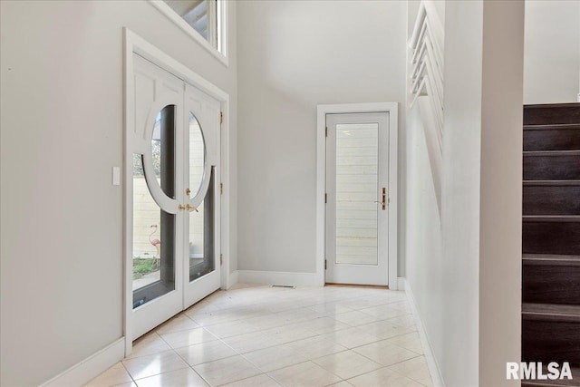 foyer entrance featuring light tile patterned floors