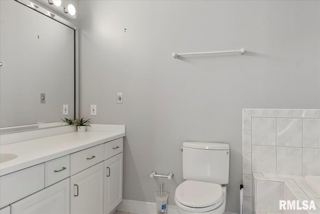 bathroom with tile patterned floors, vanity, and toilet