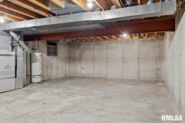 basement featuring gas water heater and heating unit