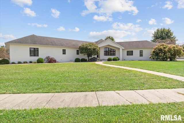 single story home featuring a front lawn