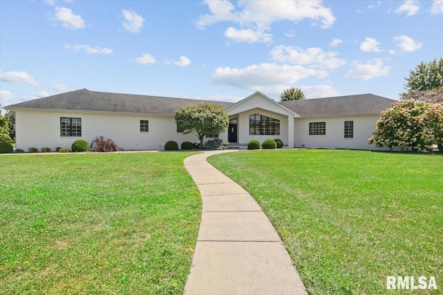 ranch-style home with a front lawn