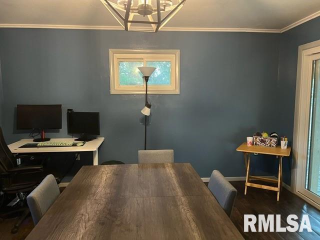 home office with crown molding, a notable chandelier, and wood-type flooring