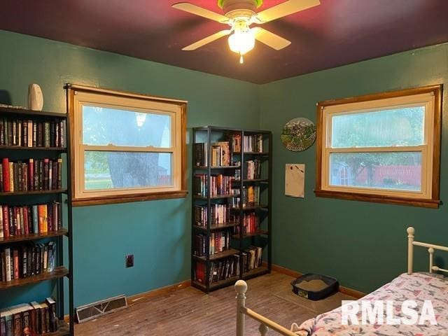 bedroom featuring ceiling fan and hardwood / wood-style flooring