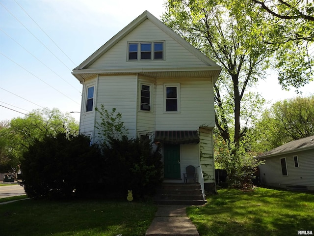 view of front of home with a front yard