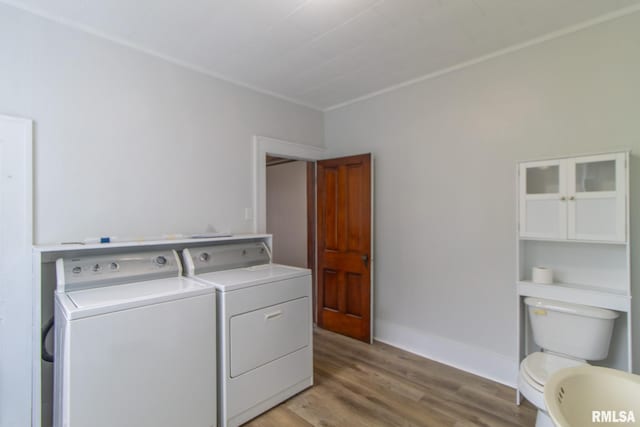 washroom featuring light hardwood / wood-style floors and separate washer and dryer