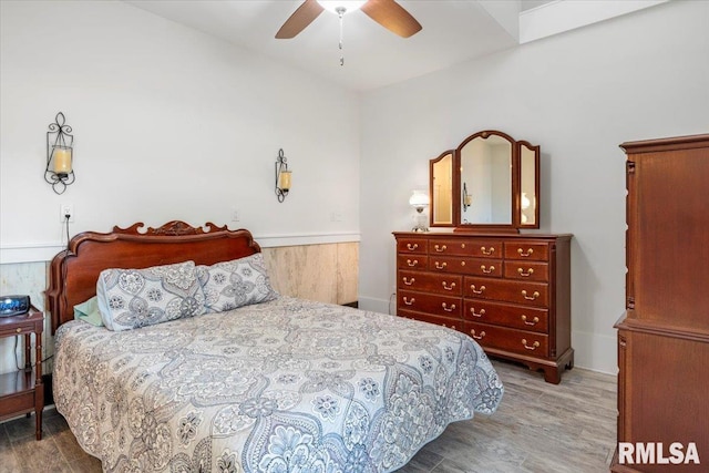 bedroom with hardwood / wood-style flooring and ceiling fan