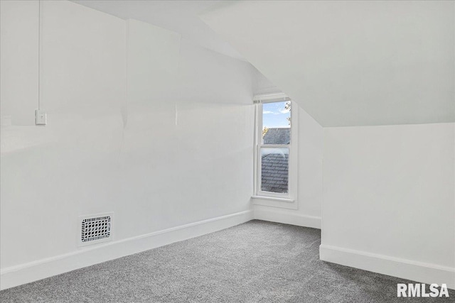 bonus room featuring lofted ceiling and carpet floors