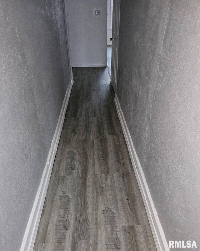 hallway with wood-type flooring