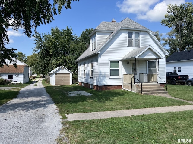 view of front facade with a garage, an outdoor structure, and a front yard