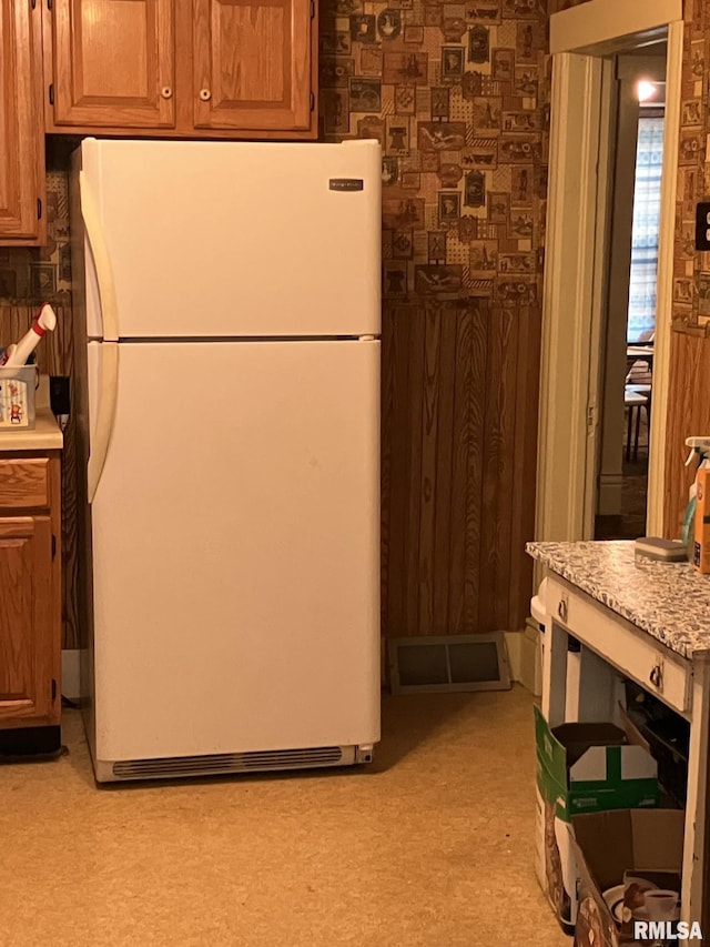 kitchen featuring white refrigerator