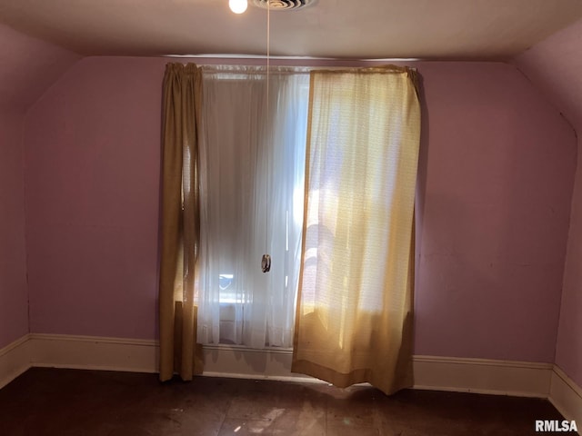 bonus room featuring vaulted ceiling