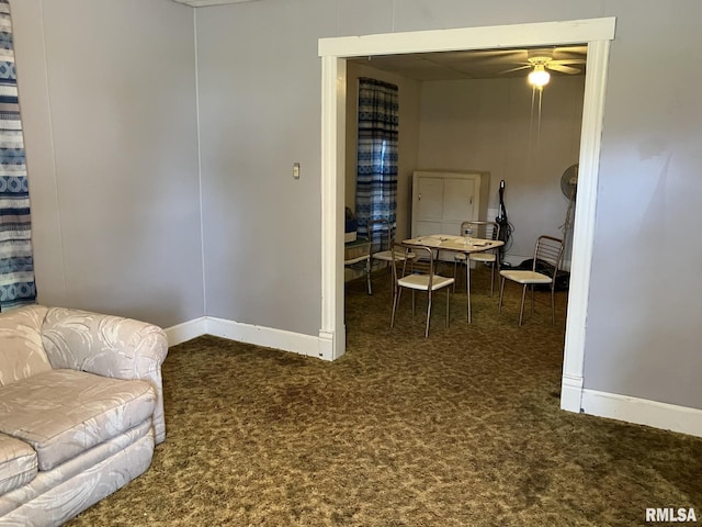 interior space featuring ceiling fan and carpet