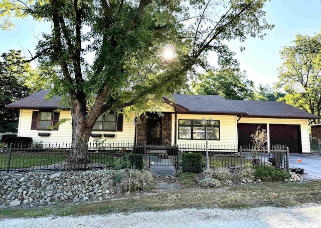 single story home featuring a garage