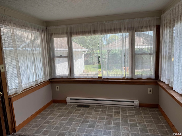 unfurnished sunroom with a wealth of natural light and a baseboard radiator