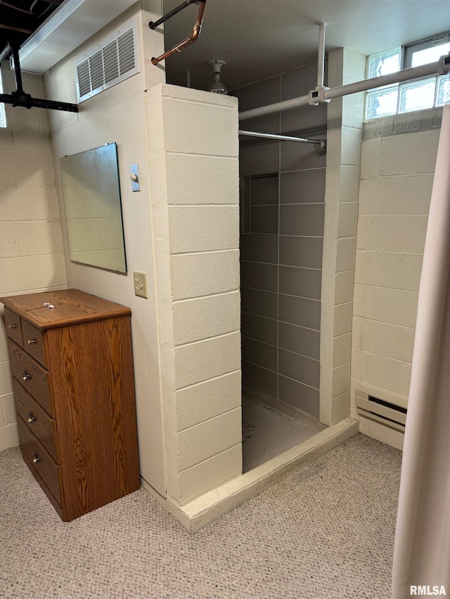 bathroom with baseboard heating and walk in shower