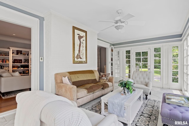 living room featuring ceiling fan and ornamental molding