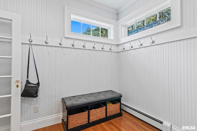 mudroom featuring a baseboard radiator, ornamental molding, and hardwood / wood-style floors