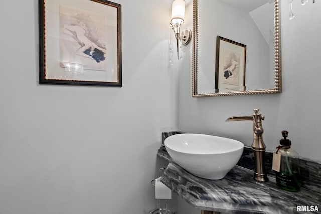 bathroom featuring lofted ceiling