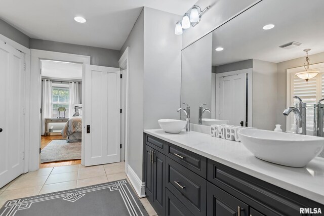 bathroom with vanity and wood-type flooring