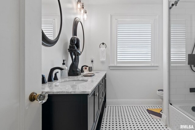 full bathroom with toilet, tiled shower / bath combo, and vanity