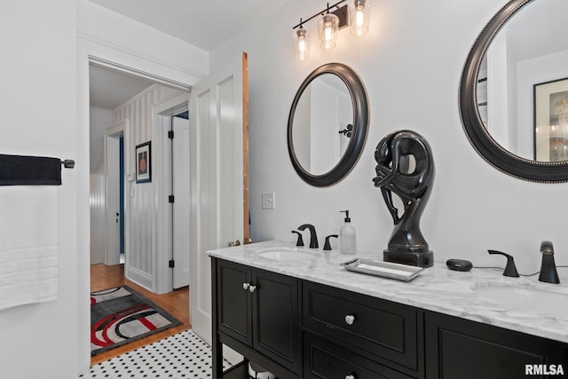 bathroom with double vanity and a sink