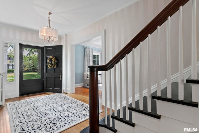 entryway featuring light wood-type flooring and a healthy amount of sunlight