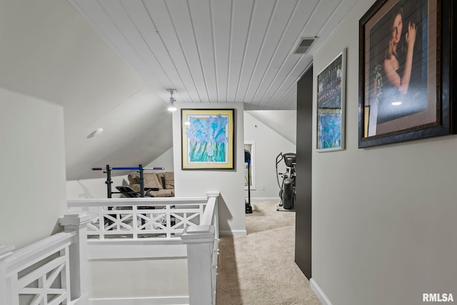 interior space featuring vaulted ceiling and carpet floors