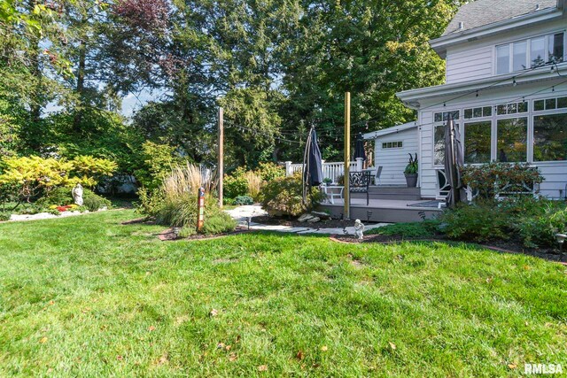 view of yard featuring a wooden deck