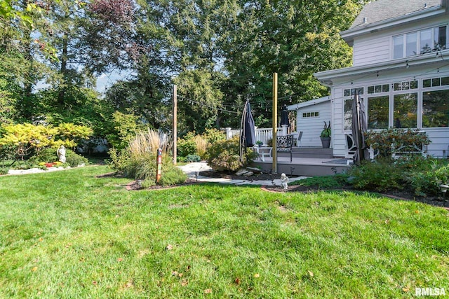 view of yard with a wooden deck