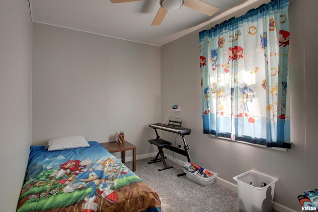 carpeted bedroom with crown molding and ceiling fan