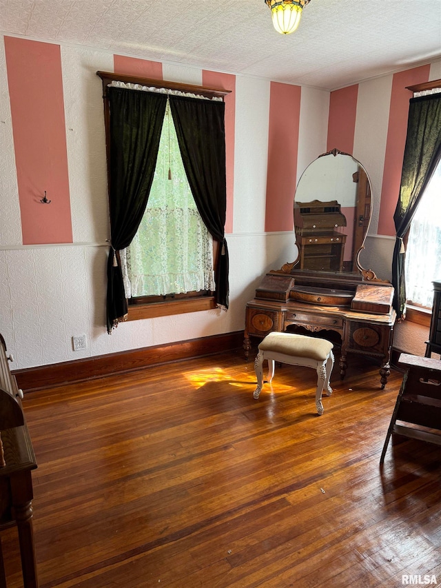 sitting room with a textured ceiling and dark hardwood / wood-style floors