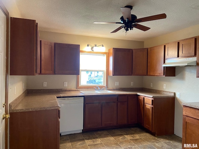 kitchen featuring a textured ceiling, dishwasher, ceiling fan, and sink