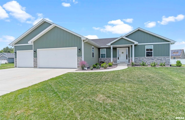 craftsman-style home with a garage and a front lawn