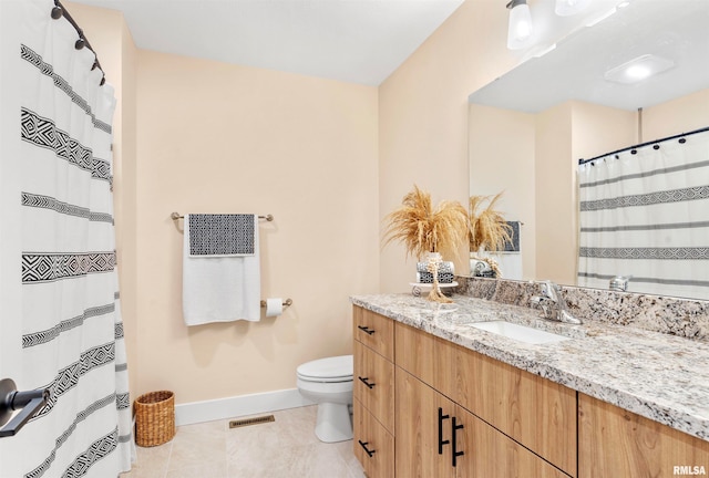 bathroom with tile patterned flooring, vanity, toilet, and a shower with curtain