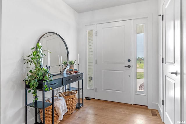 foyer with light wood-type flooring