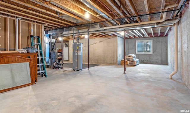 basement featuring water heater and washer / clothes dryer