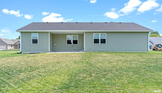 back of house featuring a yard and a patio area