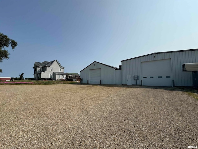 view of yard with a garage and an outdoor structure