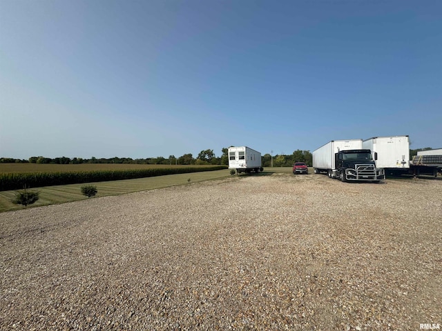 view of yard with a rural view