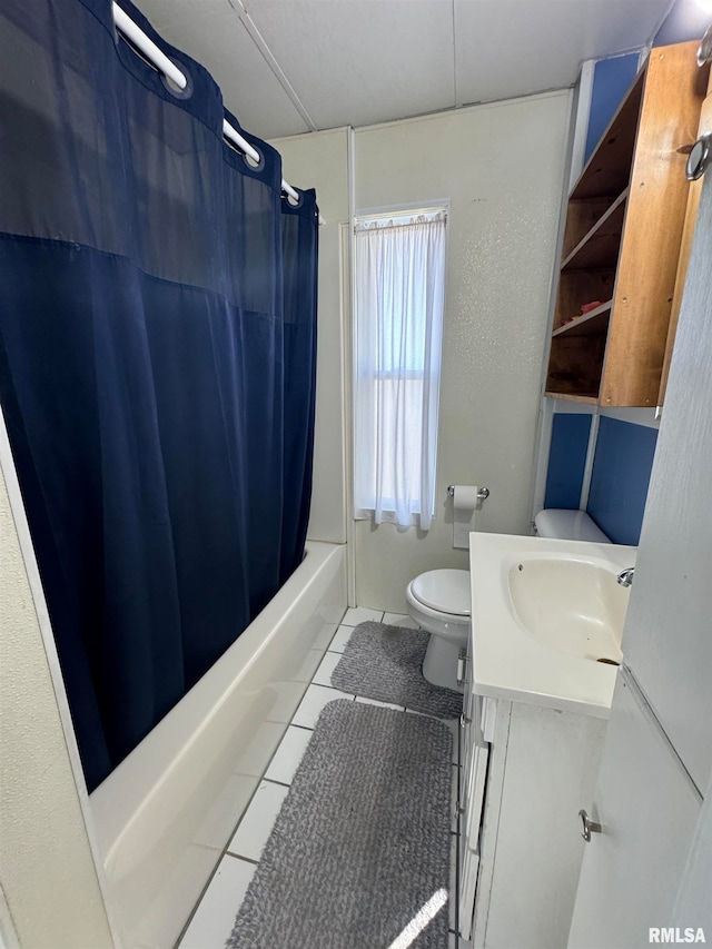 full bathroom with tile patterned flooring, toilet, shower / tub combo, and vanity