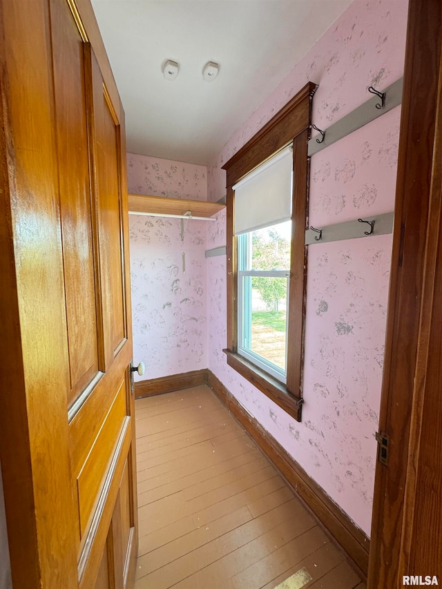 corridor featuring light hardwood / wood-style floors