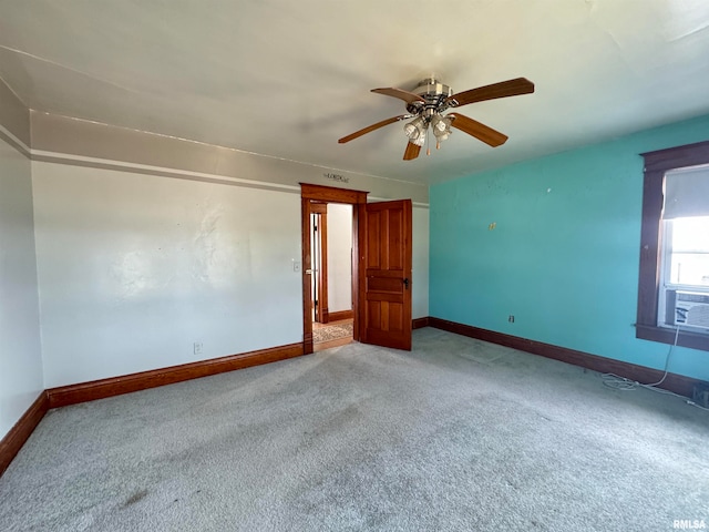 empty room with carpet flooring and ceiling fan