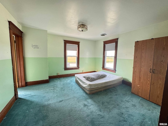 unfurnished bedroom featuring carpet flooring